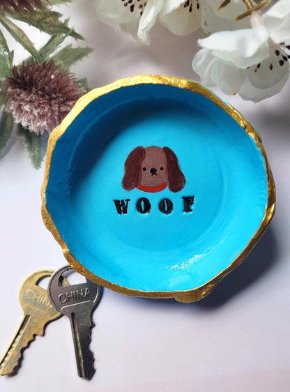 Blue Dog Trinket dish with Woof text on it.