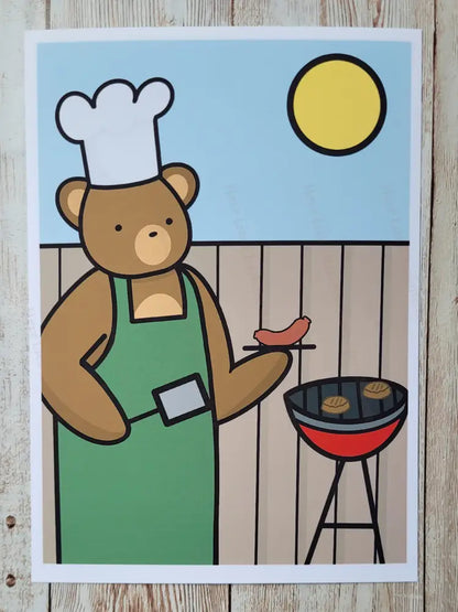 Cartoon bear in an apron and chef's hat grilling on a barbecue with a blue sky and sun in the background.