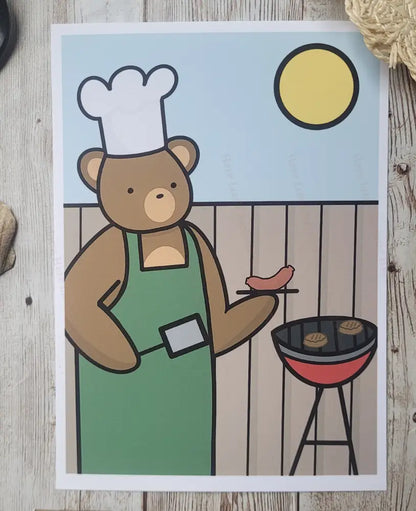 Cartoon bear in a chef hat and apron grilling hot dogs on a barbecue.